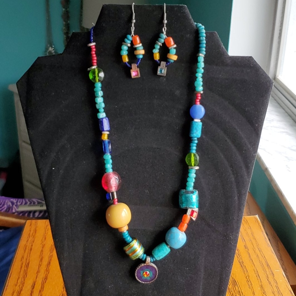 Necklace and earrings with glass and clay beads.